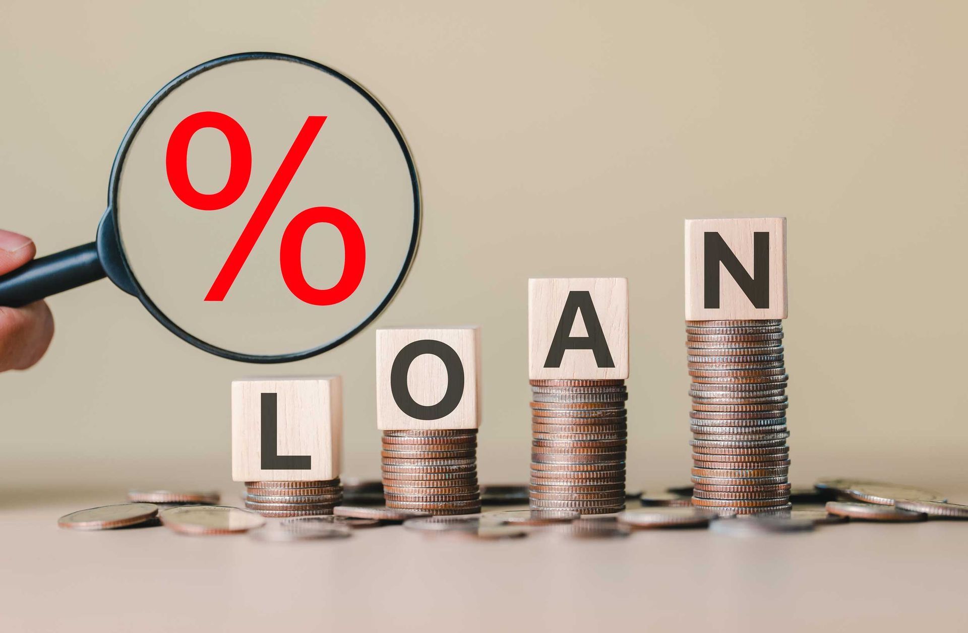 Stacked coins with blocks spelling LOAN showcasing personal installment loans and interest rates. Stacked coins with blocks spelling LOAN showcasing personal installment loans and interest rates.