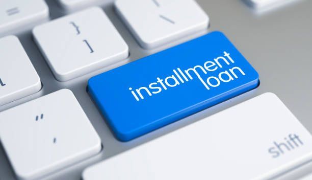 Online Service Concept: Applying for an Installment Loan on a Keyboard Background.