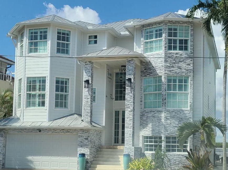 A large white house with a lot of windows