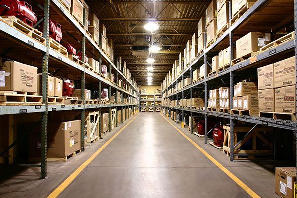 A large warehouse filled with lots of boxes and pallets