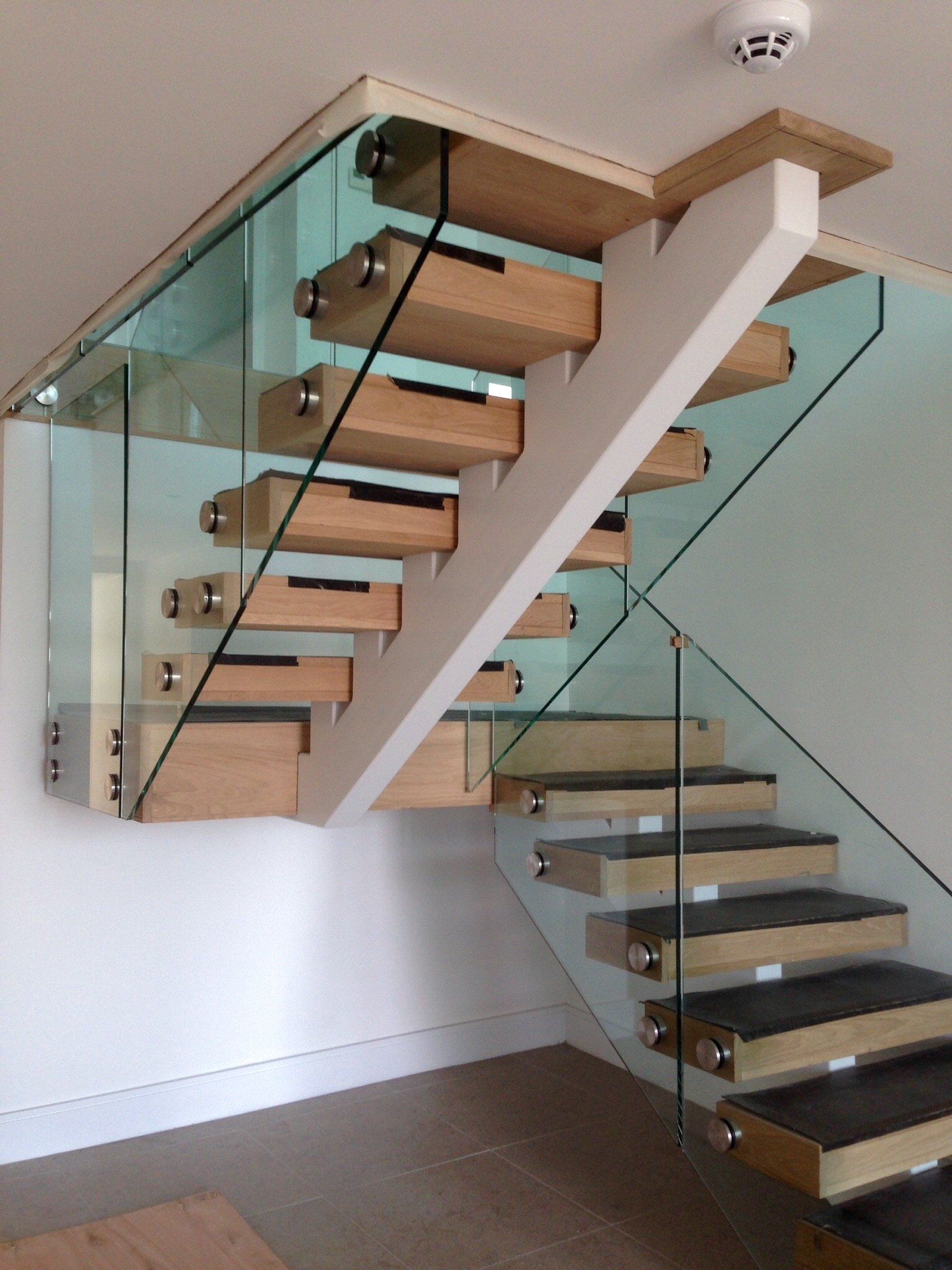 stairs made of glass and wood