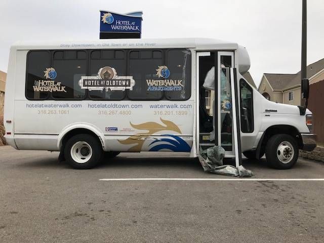 A white bus with the word waterwalk on the side