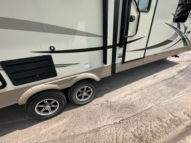 A trailer is parked on the side of the road.