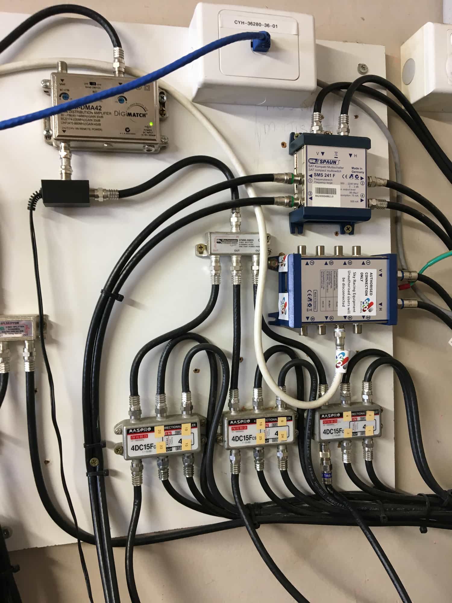 A Wall With a Bunch of Wires Connected to It — Hendo's TV Antennas & Installations in White Rock, QLD