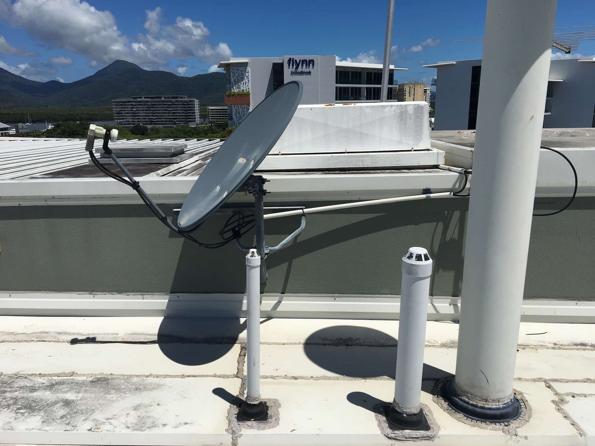 A Satellite Dish on the Roof of a Building — Hendo's TV Antennas & Installations in Trinity Beach, QLD