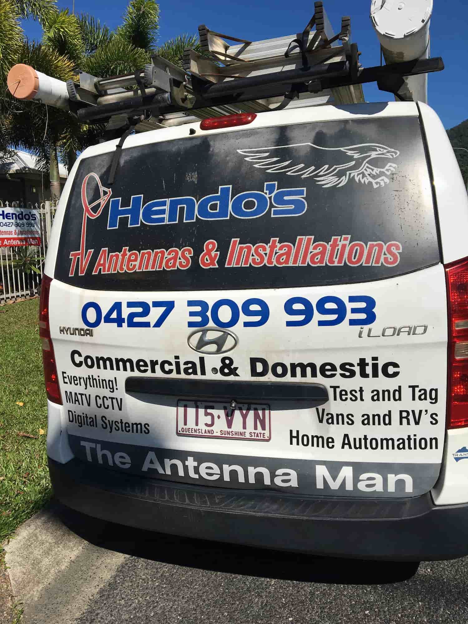 A White Van With Antennas on Top of It is Parked on the Side of the Road — Hendo's TV Antennas & Installations in White Rock, QLD