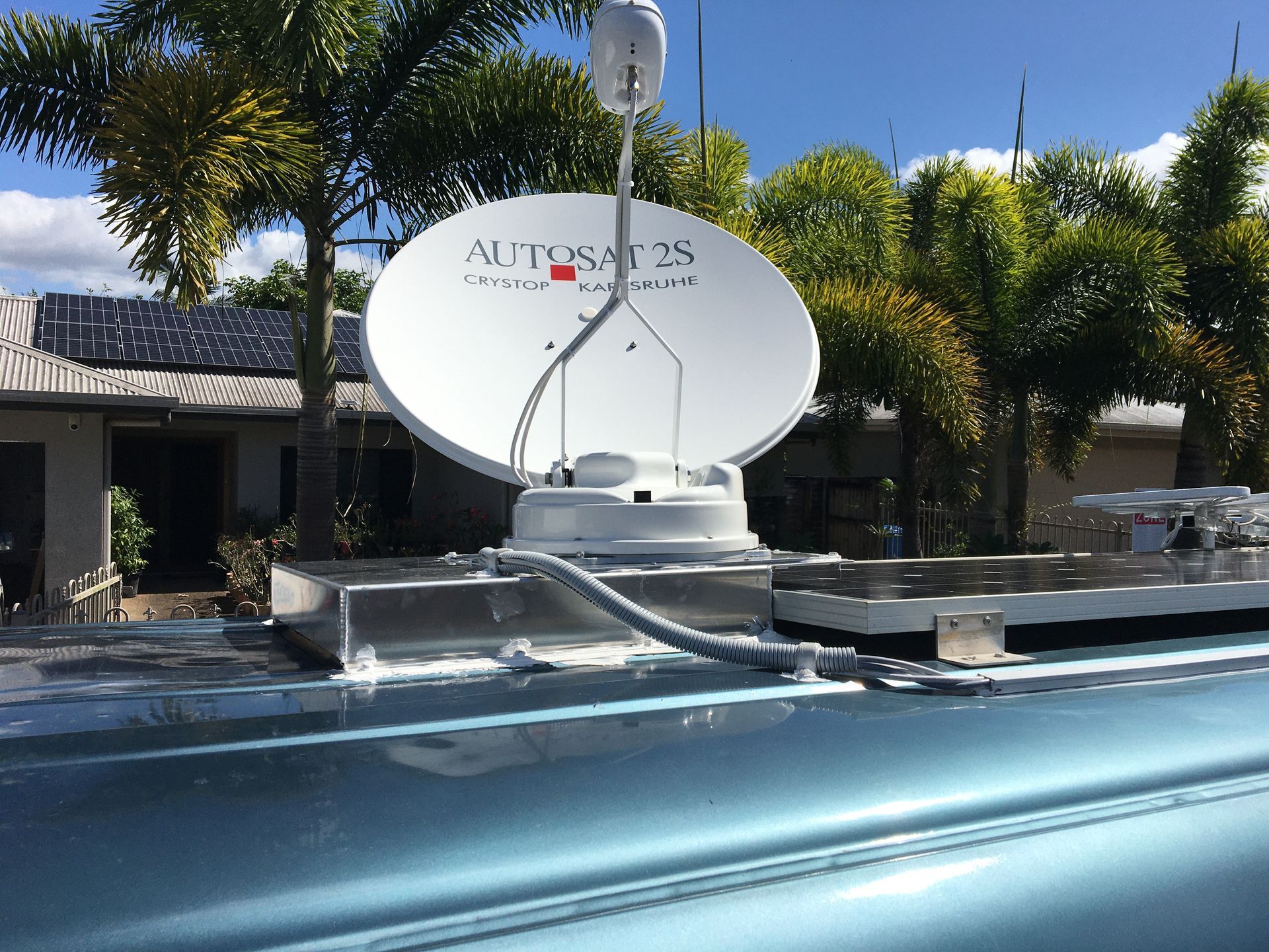 A Blustream Device is Sitting on a Wooden Table — Hendo's TV Antennas & Installations in Mission Beach, QLD
