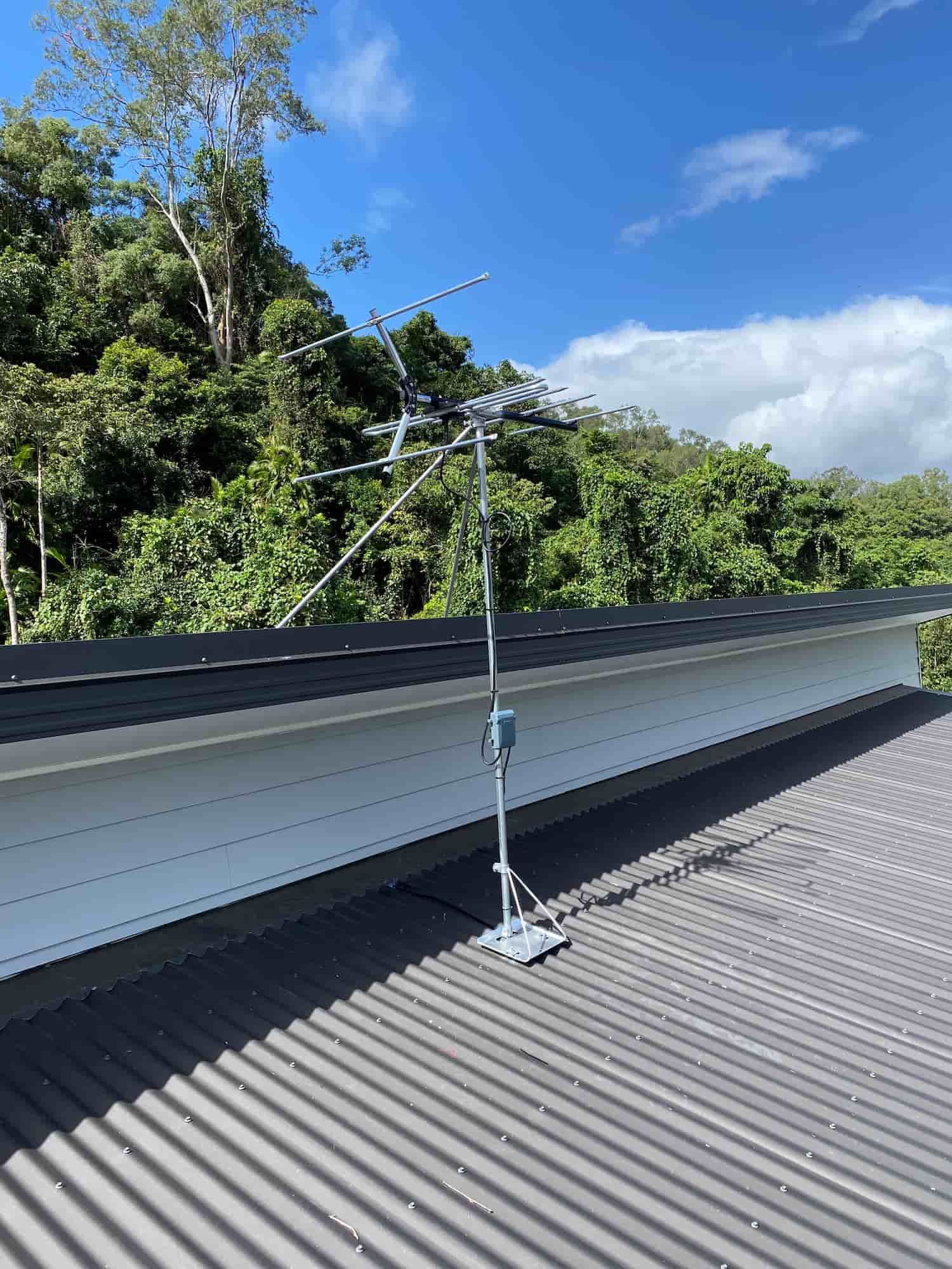 An Antenna is Sitting on Top of a Corrugated Metal Roof — Hendo's TV Antennas & Installations in White Rock, QLD