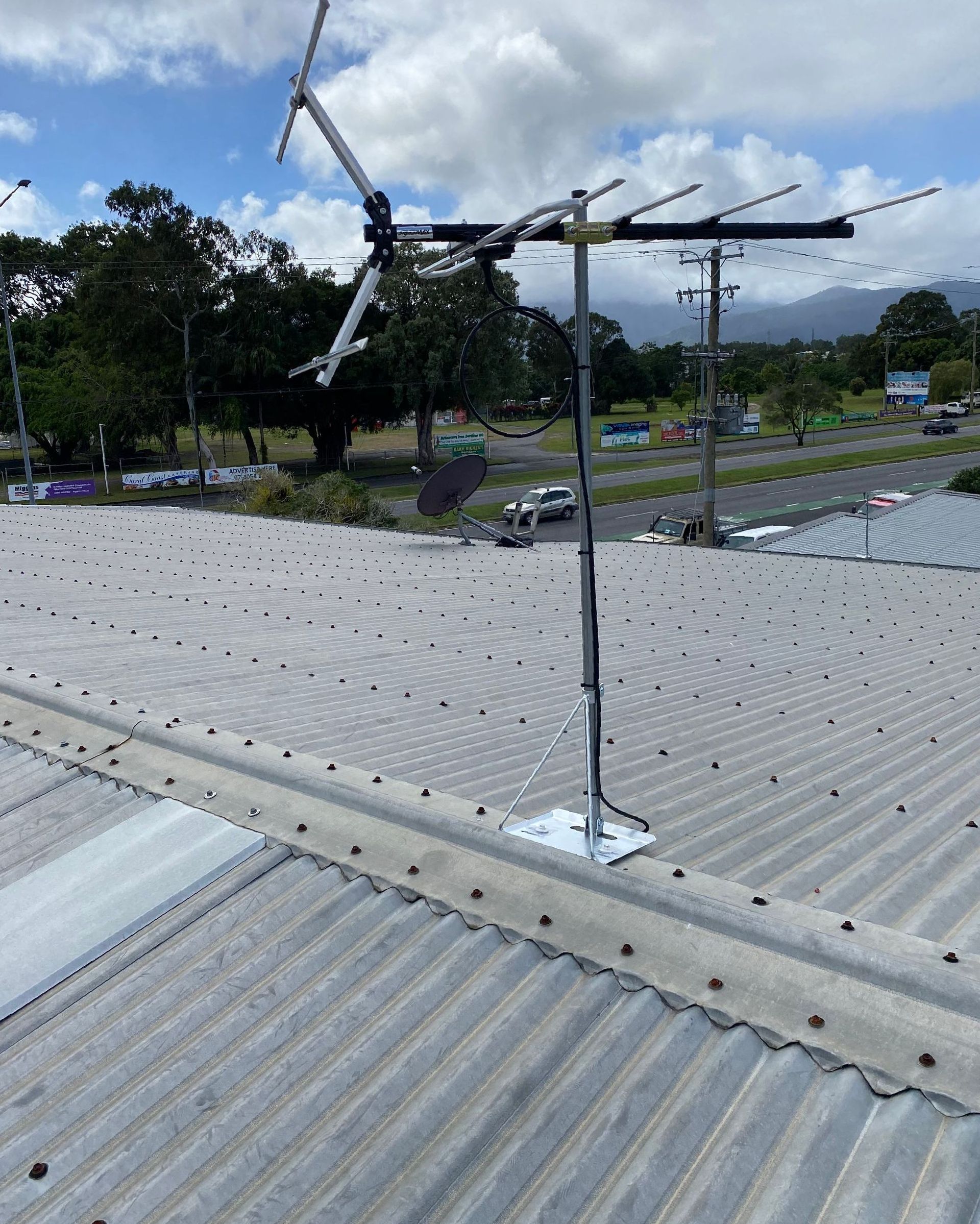 A Bunch of Wires Are Hanging From a Wall — Hendo's TV Antennas & Installations in Tablelands, QLD