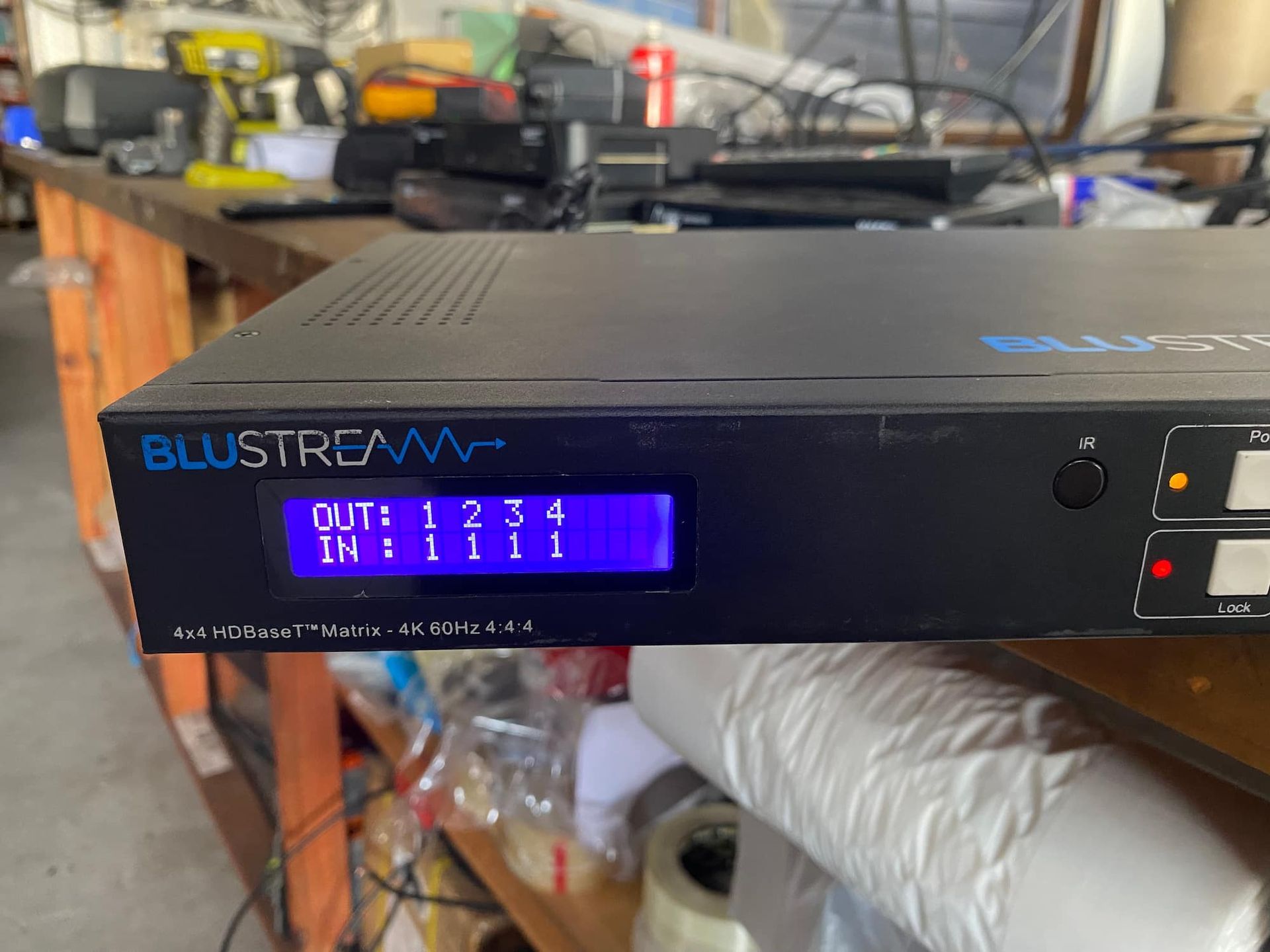 A Blustream Device is Sitting on a Wooden Table — Hendo's TV Antennas & Installations in White Rock, QLD