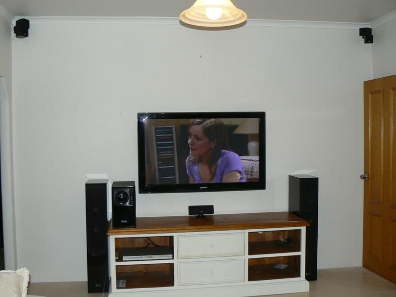 A Flat Screen Tv Shows a Woman in a Purple Shirt — Hendo's TV Antennas & Installations in White Rock, QLD