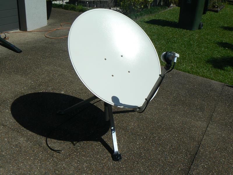 A White Satellite Dish is Sitting on a Sidewalk — Hendo's TV Antennas & Installations in White Rock, QLD