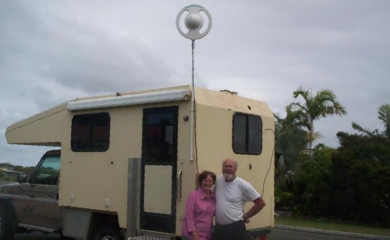 A Man and Woman Standing in Front of a Camper — Hendo's TV Antennas & Installations in White Rock, QLD