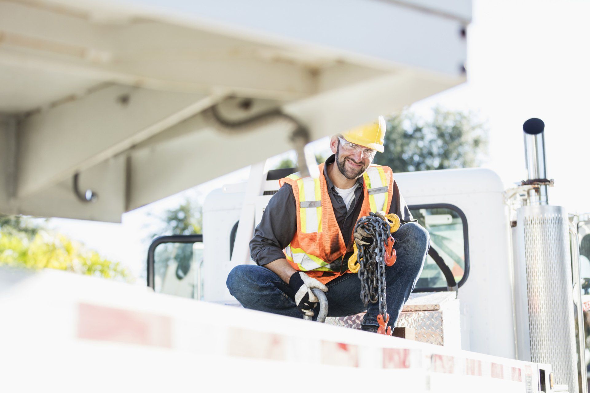 Construction Worker on the Bed of a Crane — Saint Petersburg, FL — On Demand Crane Service
