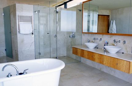 Woman in a bathroom done by a quality tilers in Northland