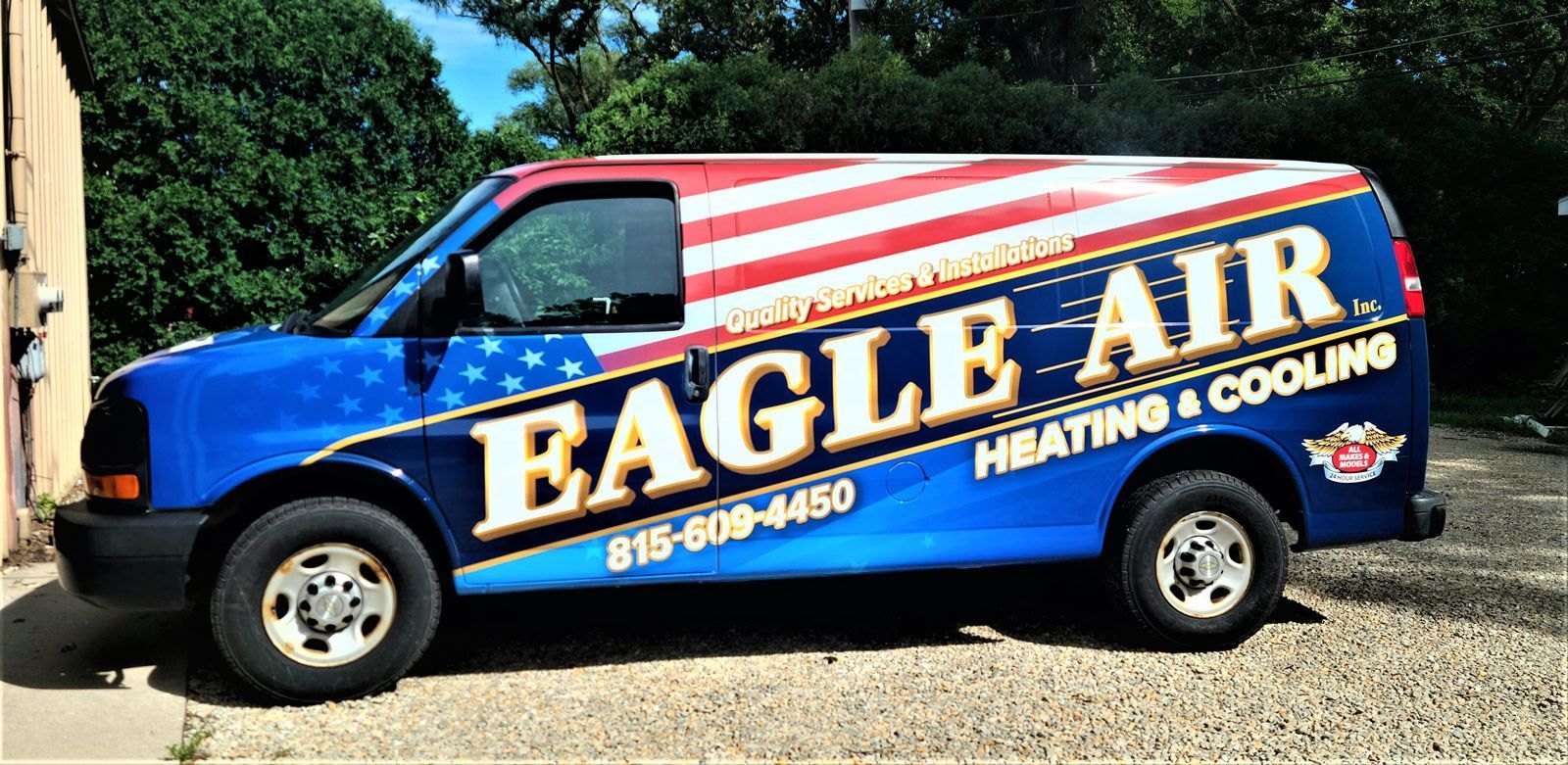 A blue van with an American flag design, with the words 