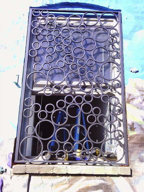 A wrought iron fence with circles on it