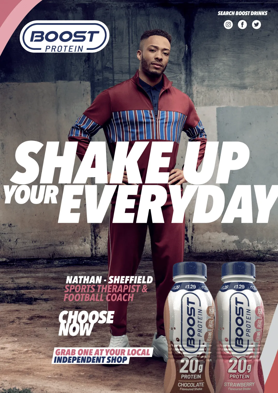 A man is standing in front of two bottles of boost protein.