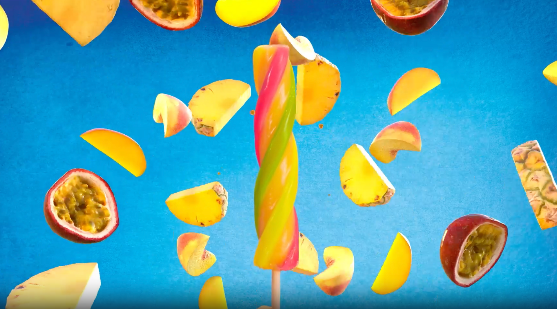 A colorful popsicle is surrounded by fruit slices on a blue background.