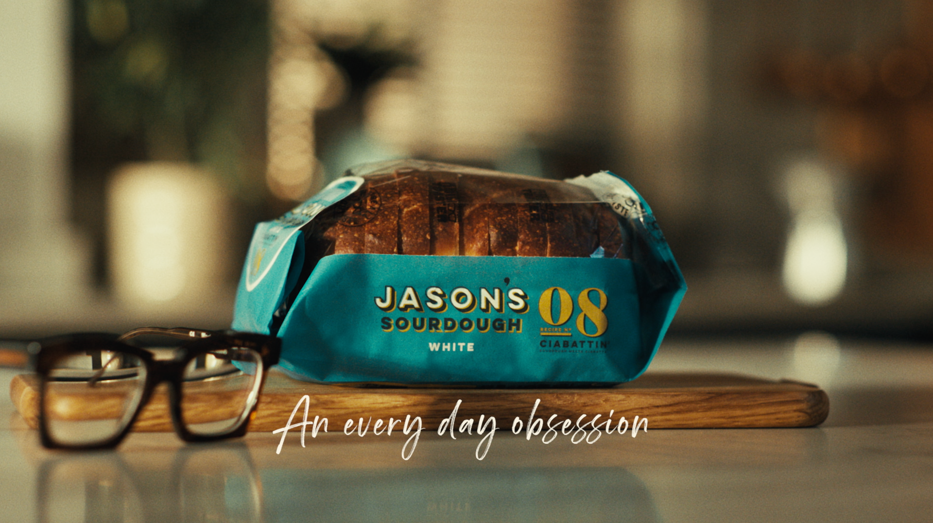 A man is looking at a large pile of dough.