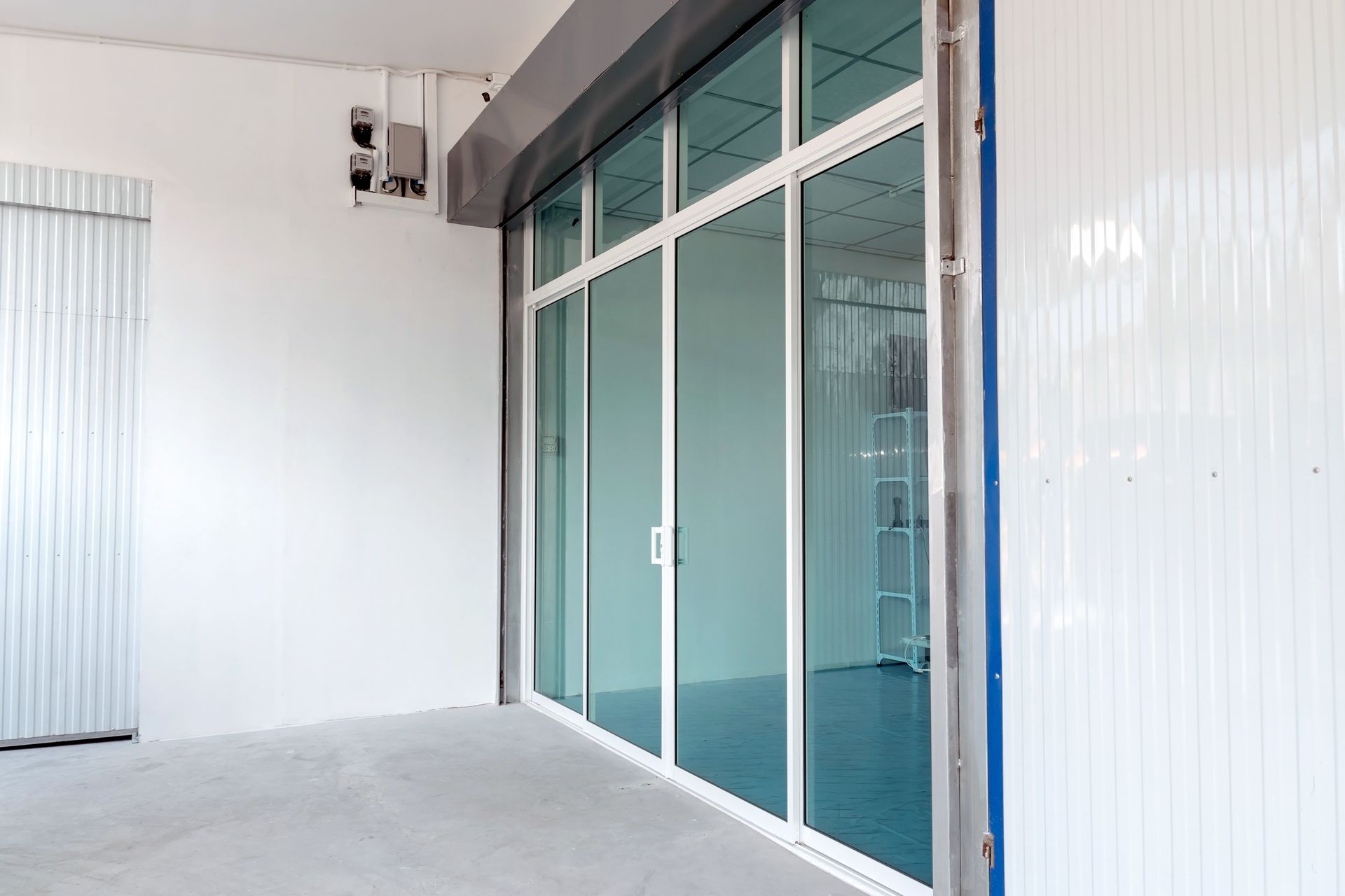 An empty building with a lot of windows and doors.