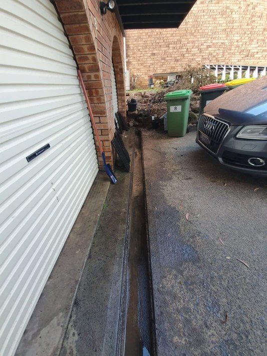 After Cleaning The Gutter On The Garage — Gutter Cleaning Services in Terrace, NSW