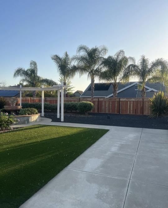 a wooden fence is being built in front of a house