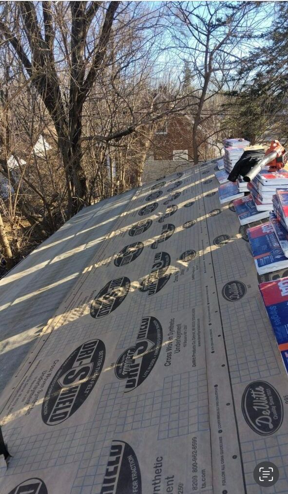 A roof with a lot of roofing material on it.
