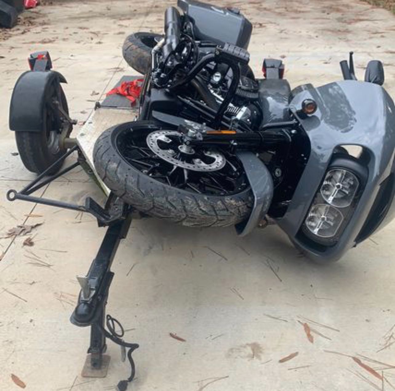 A motorcycle with a trailer attached to it