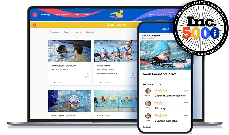 A laptop and a cell phone are sitting next to each other.