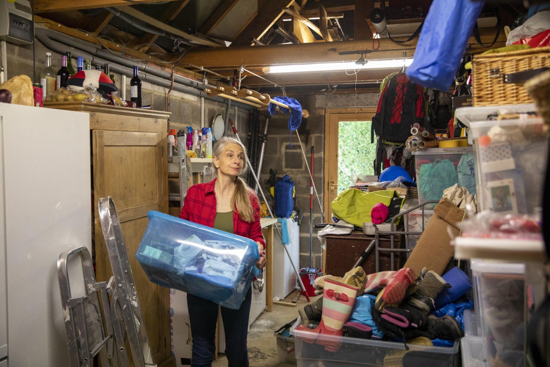 Woman Cleaning Out the Garage — Janesville, WI — Toby's Removal Woman Cleaning Out the Garage — Janesville, WI — Toby's Removal