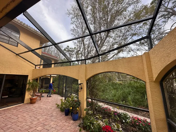 A screened in porch with a clear roof
