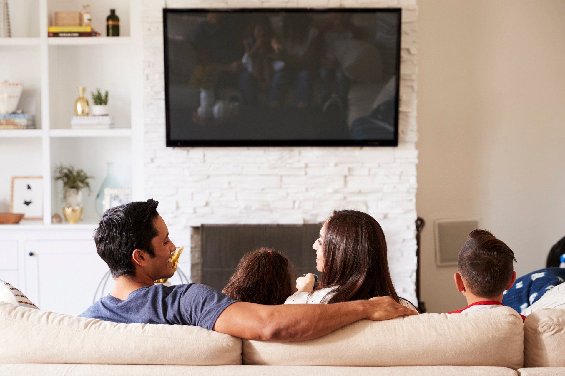 Family Watching TV — Sebring, FL — Bassett Custom Audio Video