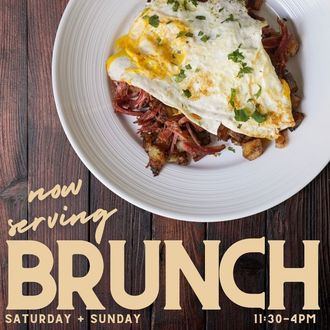 a brunch plate with corned beef and hash