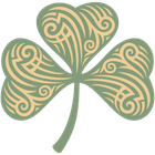A green and gold shamrock with swirls on it