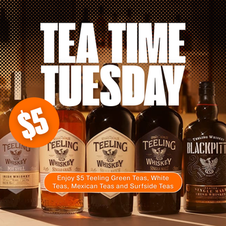 Bottles of Teeling Whiskey are lined up on a table
