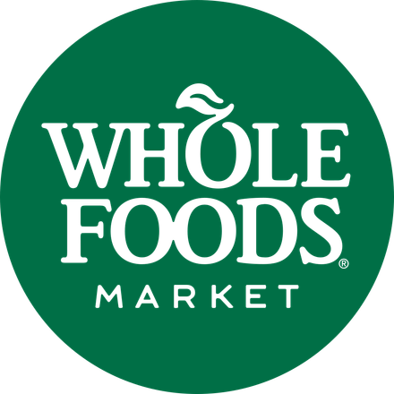 Whole Foods Market logo in white on a green circle