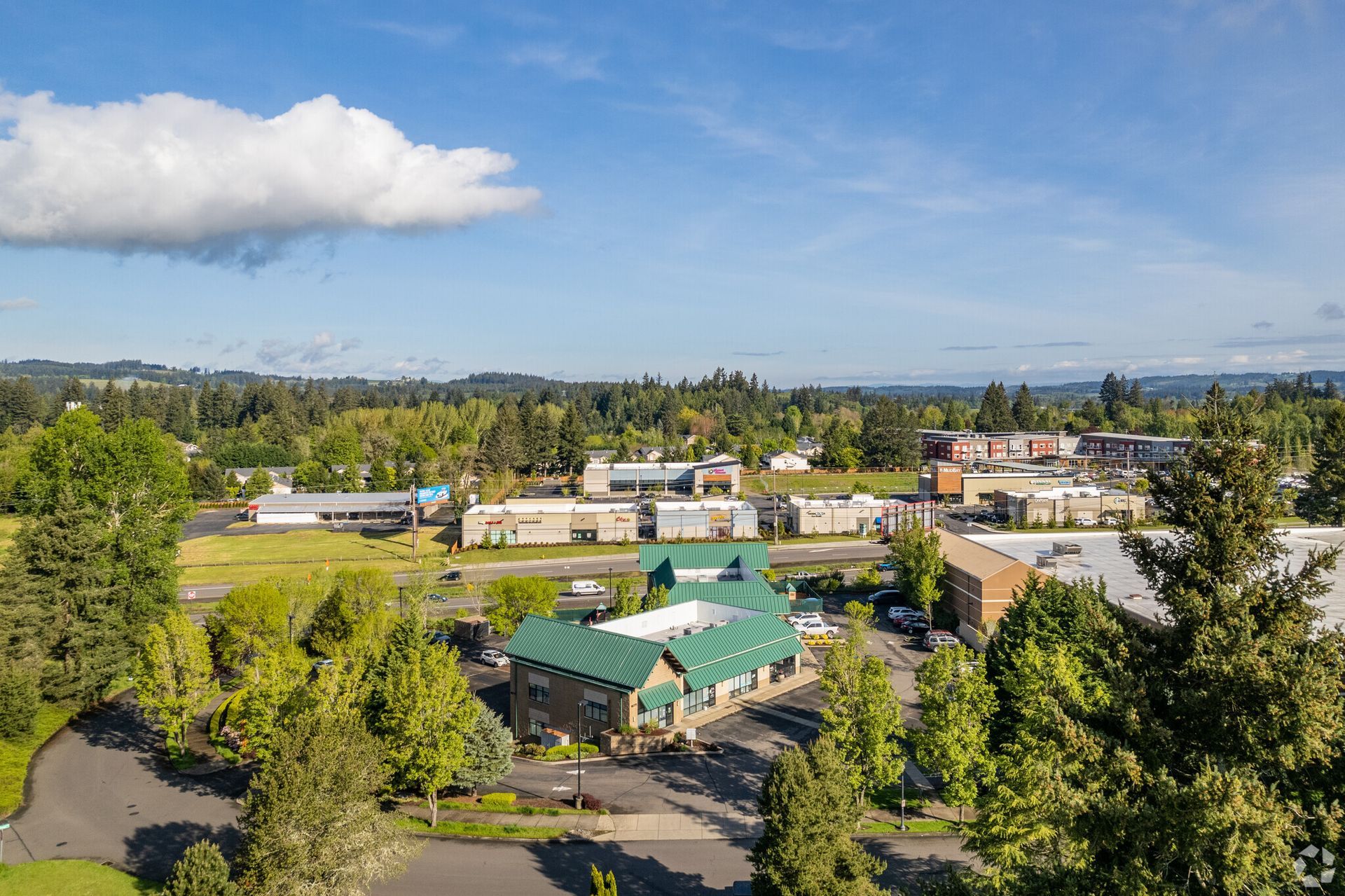 An aerial view of a city with lots of buildings and trees.