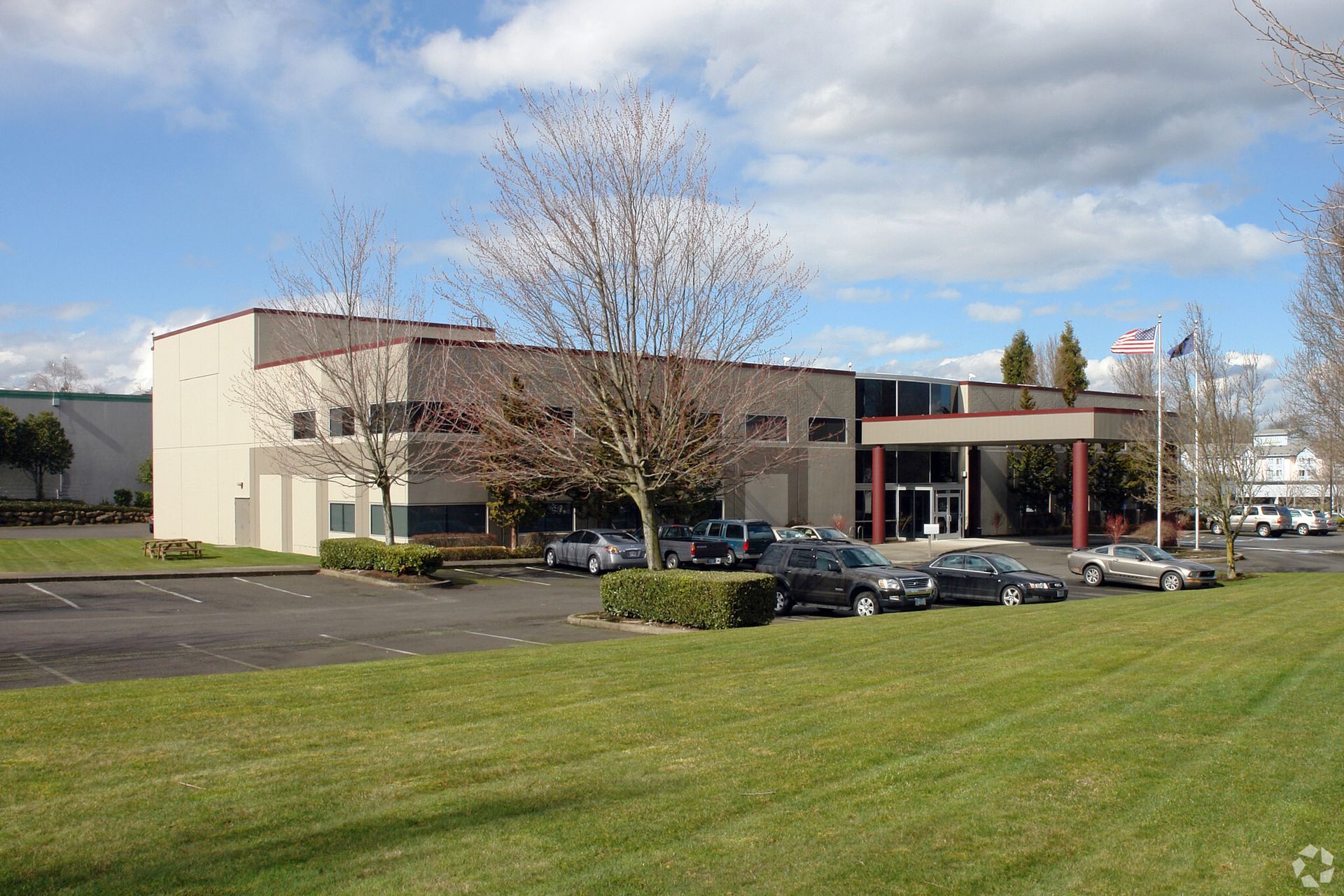 A large building with cars parked in front of it