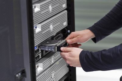 IT Professional working on a server tower