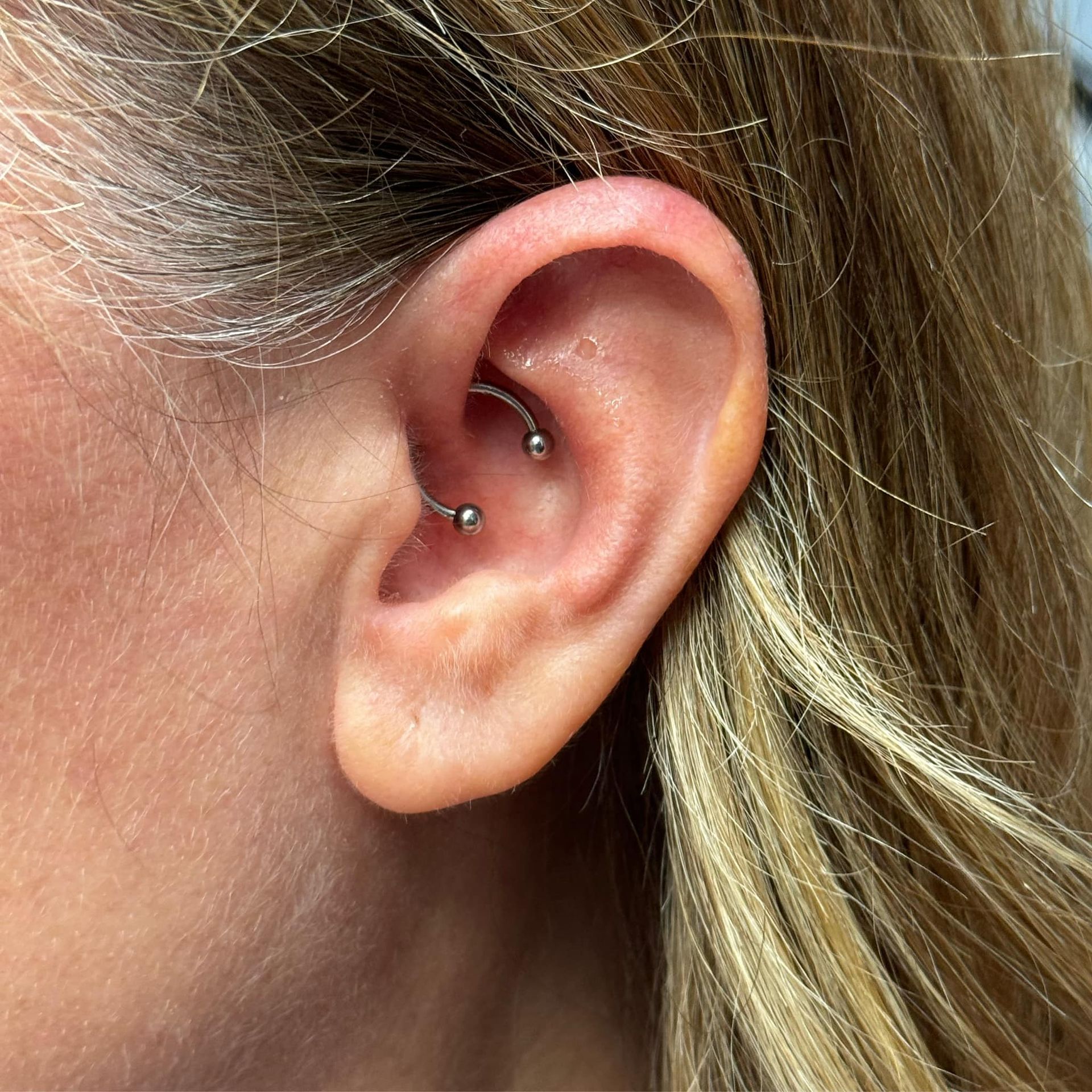 A Close-Up Of A Woman's Ear With A Lot Of Piercings - Burlington, NC - Inferno Ink Tattoo