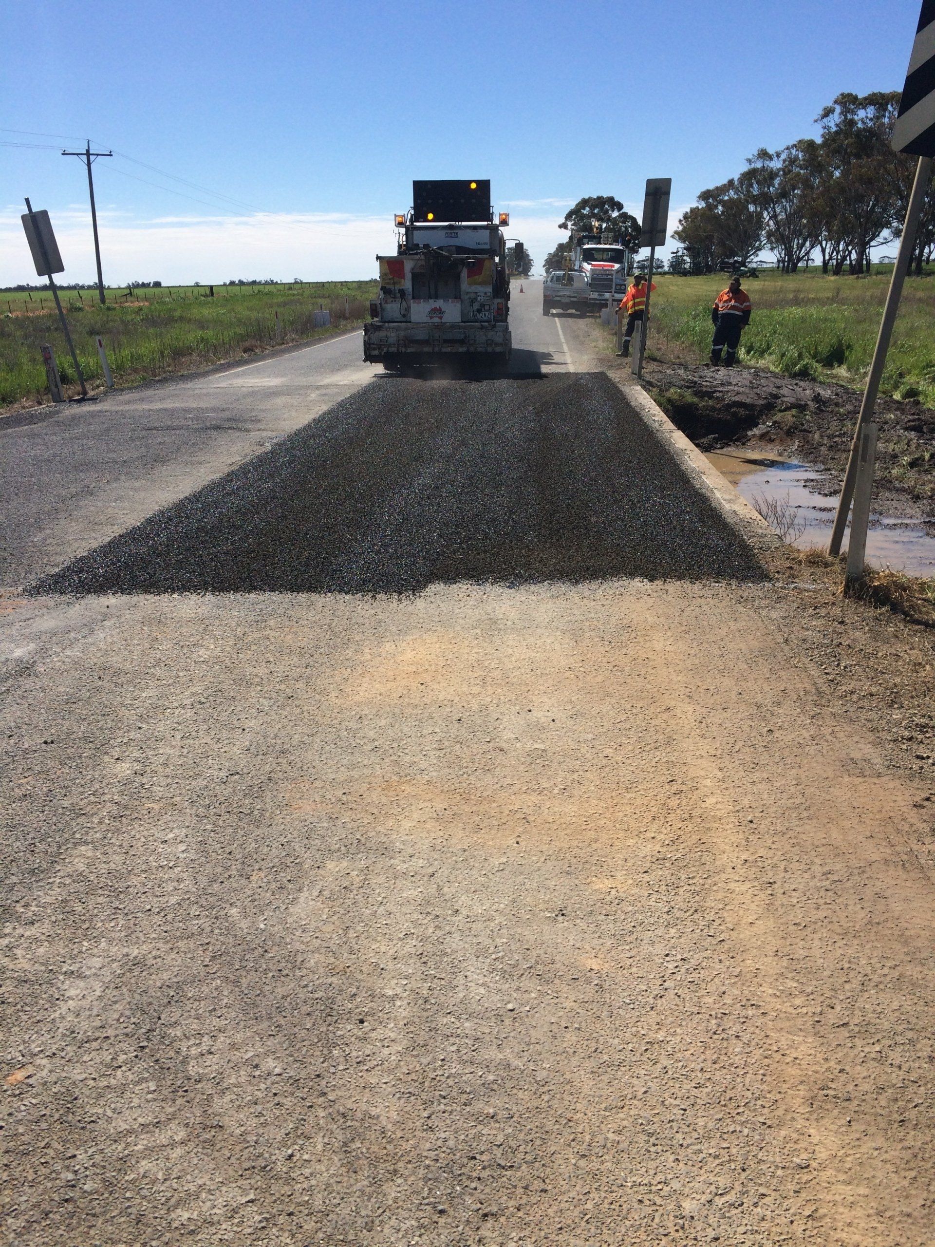 Man Adding Asphalt To The Road — Ballarat, Metro Melbourne, VIC — J & K Civil Maintenance