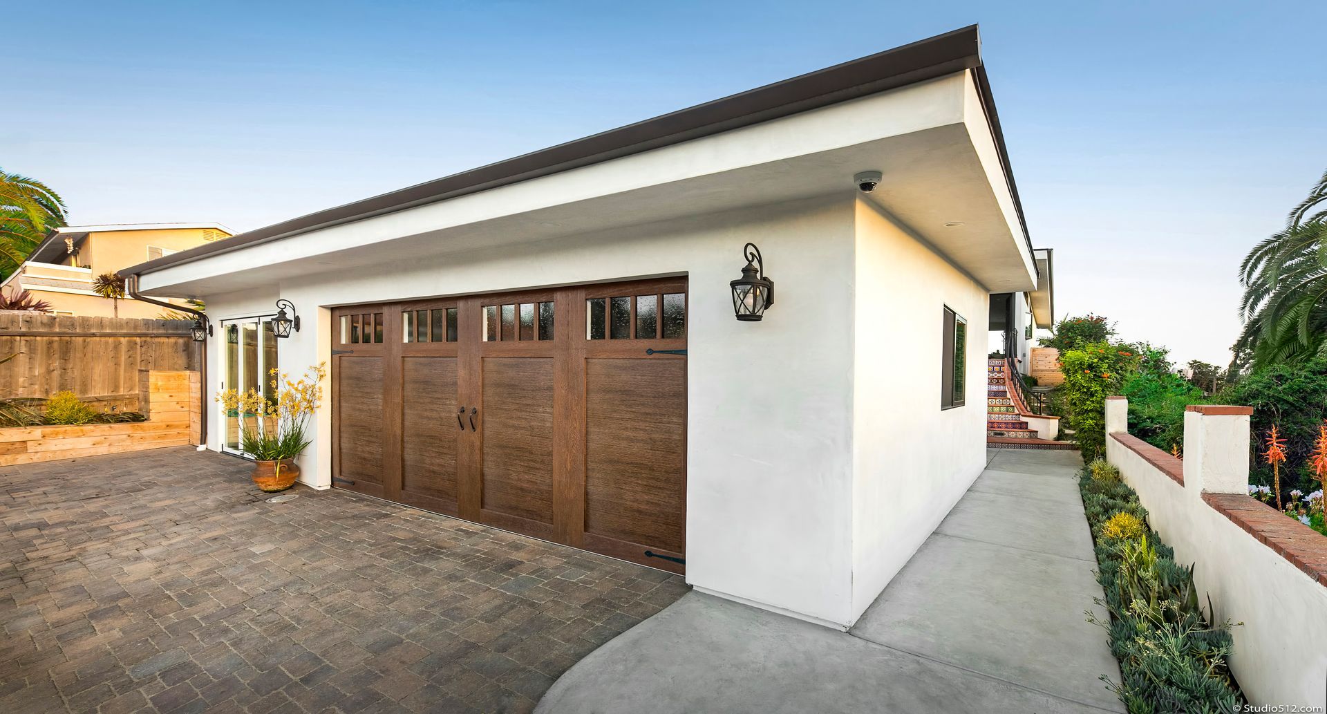 A large white house with two garage doors