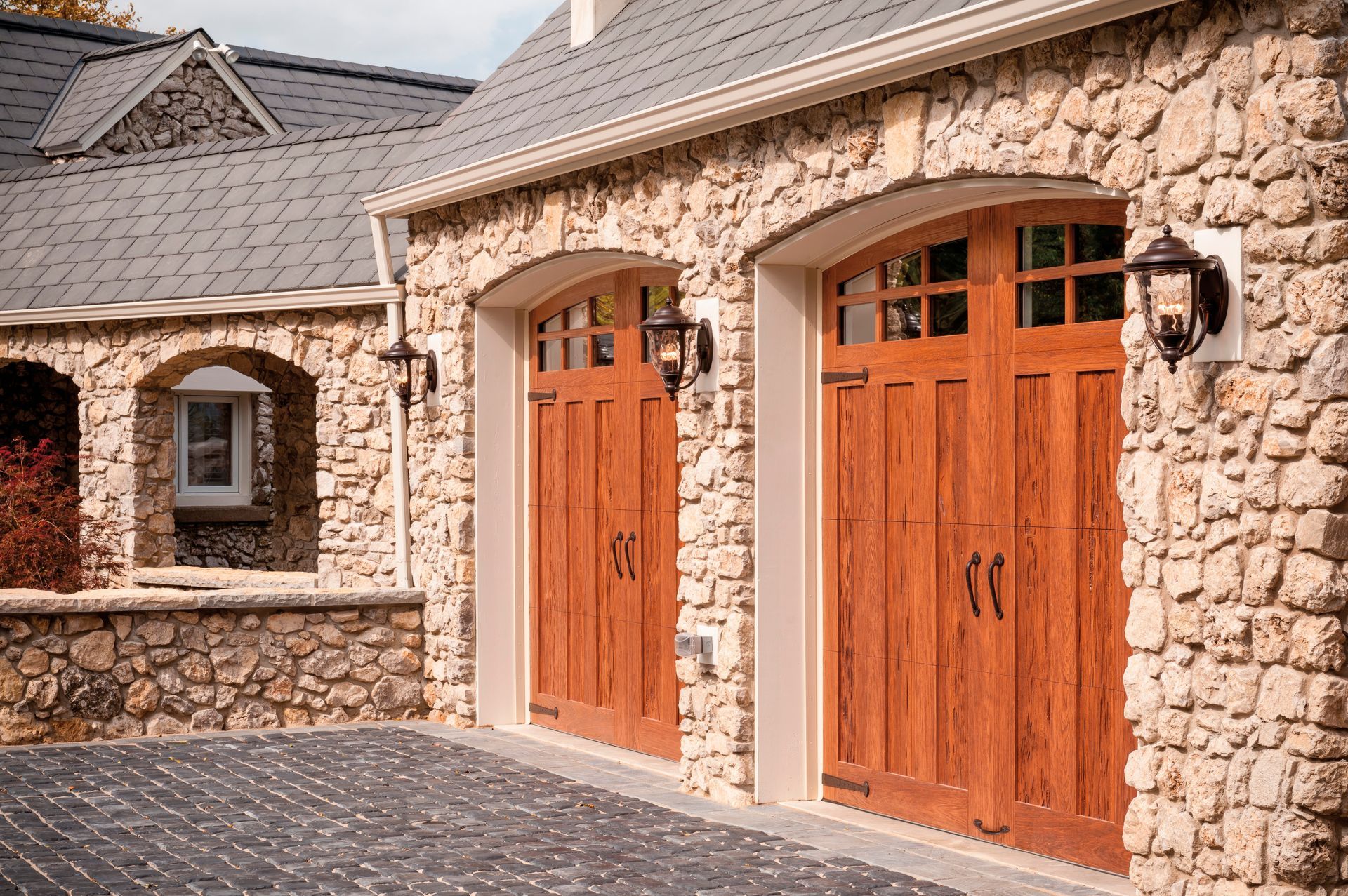 A house with a garage and solar panels on the roof.