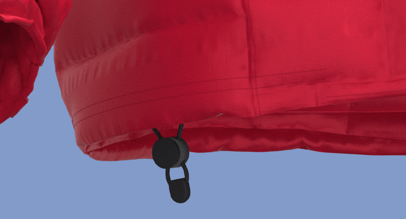 A close up of a red jacket with a black zipper on a blue background.