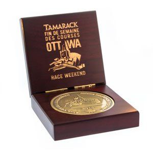 A tamrack coin in a wooden box