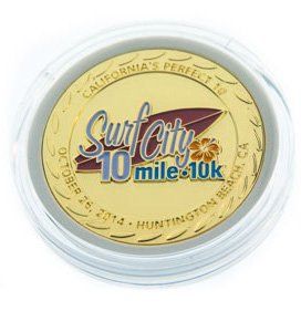 A gold coin that says surf city 10 mile 10k