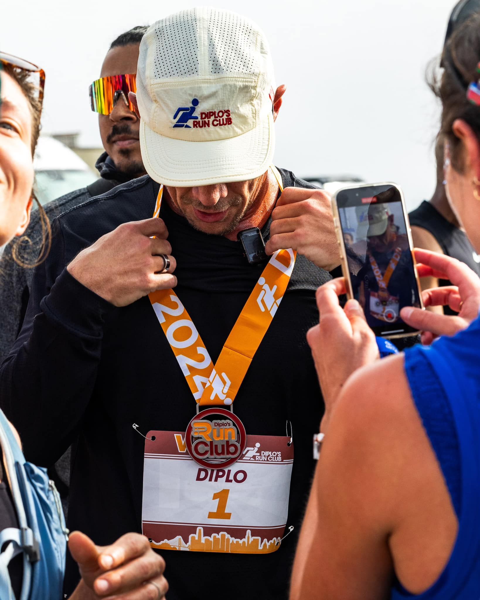 Artist Diplo with his finisher medal made by Always Advancing