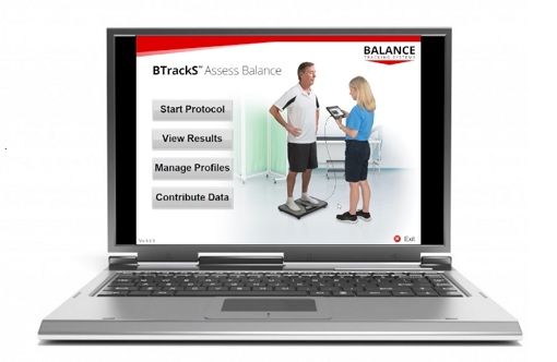 Laptop displaying balance assessment software; person standing on scale with clinician.