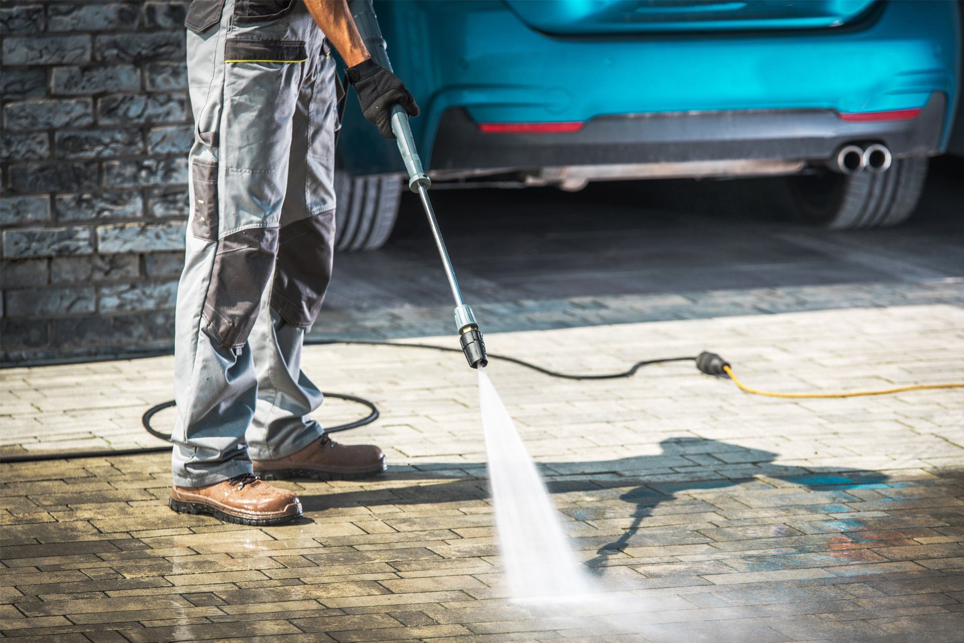 Cleaning Driveway Using Pressure Washer